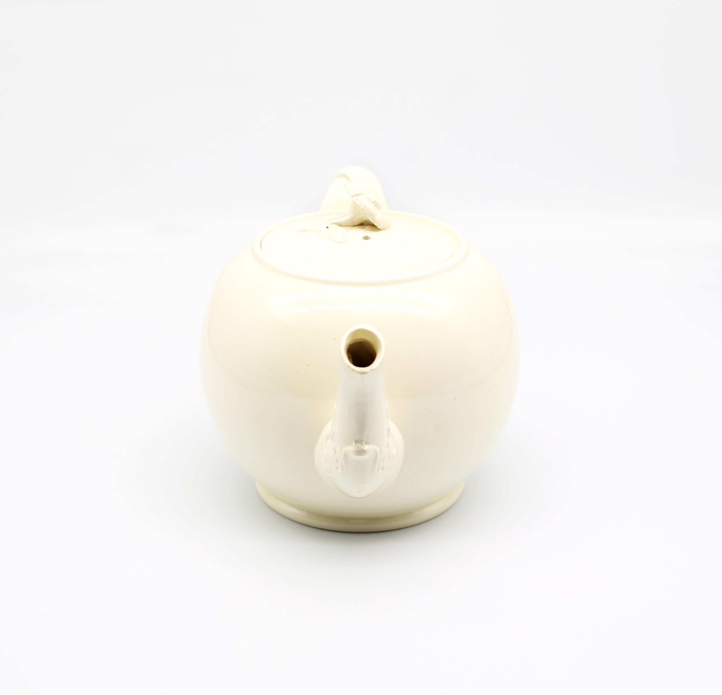 A Leeds creamware globular teapot and cover, with a twisted strap handle and floret terminals, the - Image 4 of 17