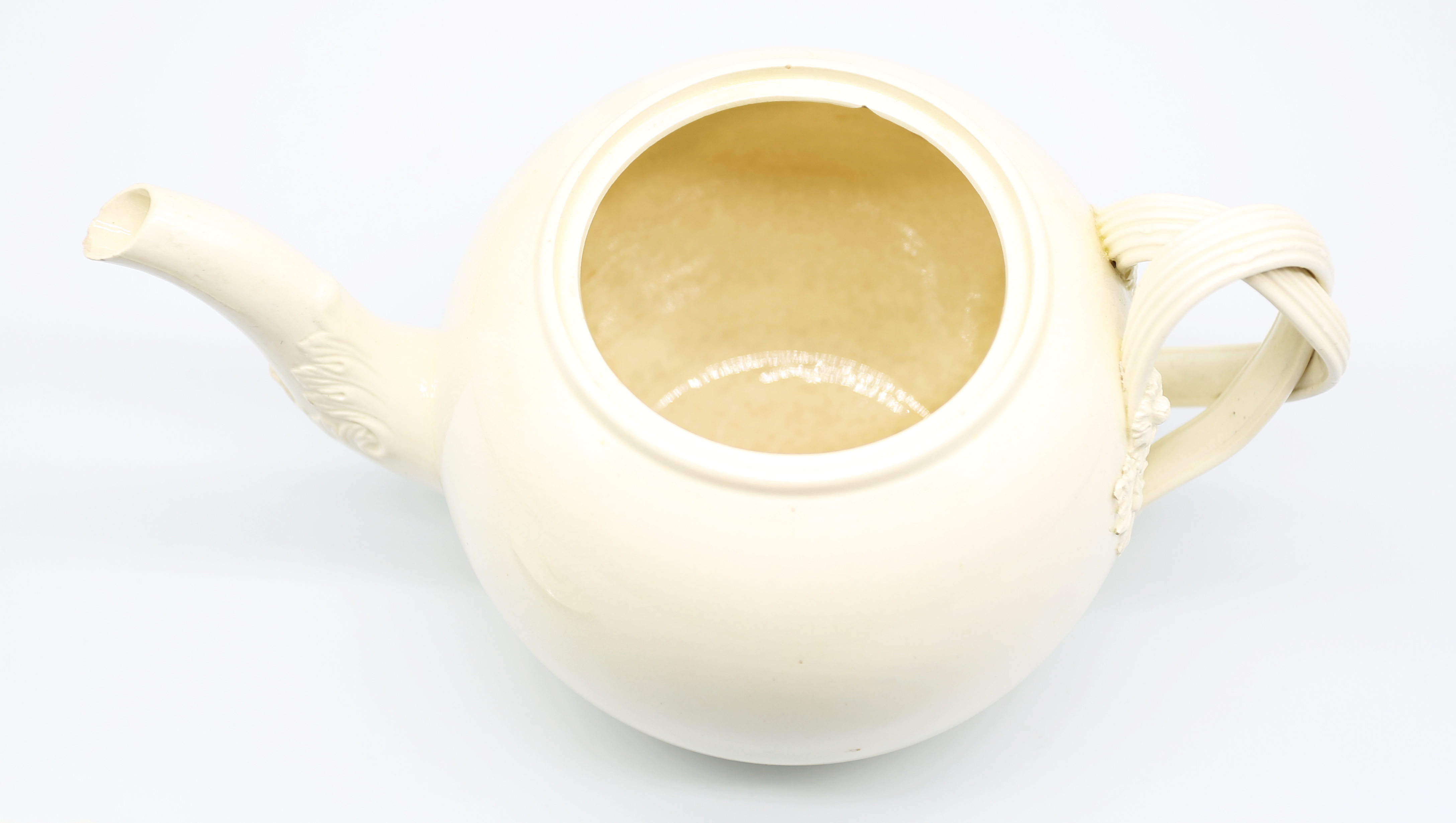 A Leeds creamware globular teapot and cover, with a twisted strap handle and floret terminals, the - Image 10 of 17