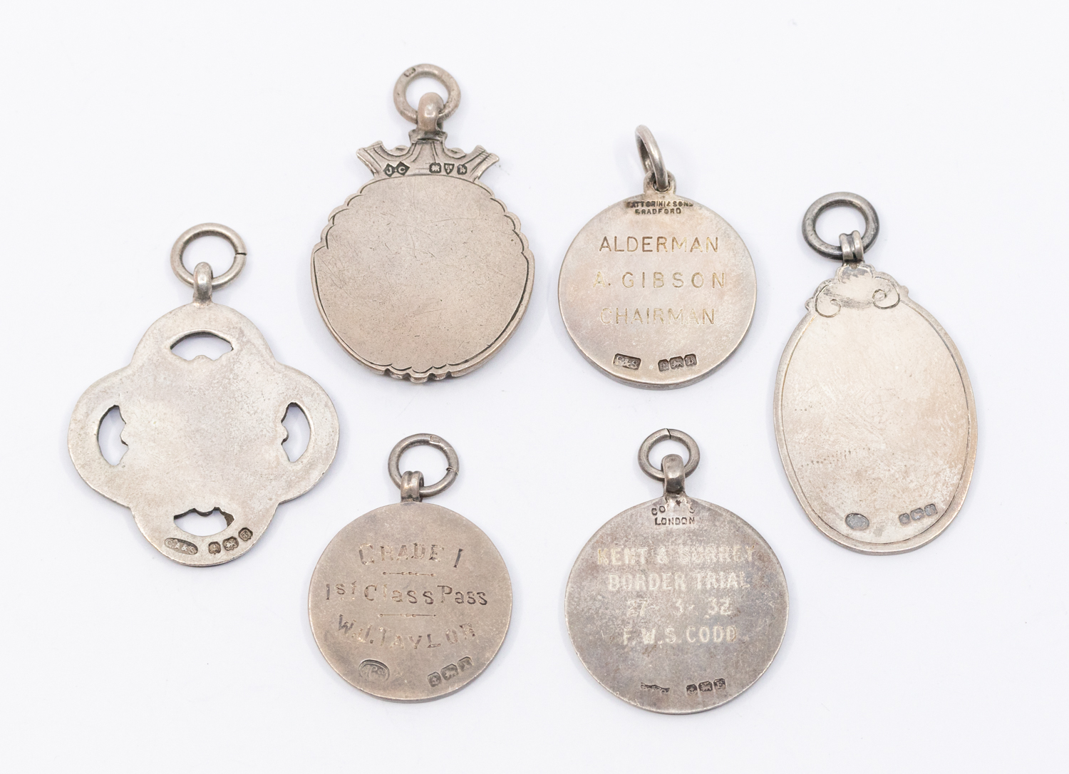 A collection of fob medals to include: a Birmingham silver fob with central enamelled deer and - Image 2 of 2