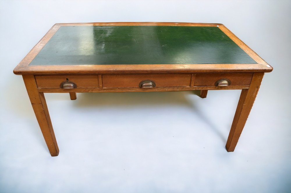 A George V/ George VI Government issue desk in oak, with original stamped brass handles, 153 x 76