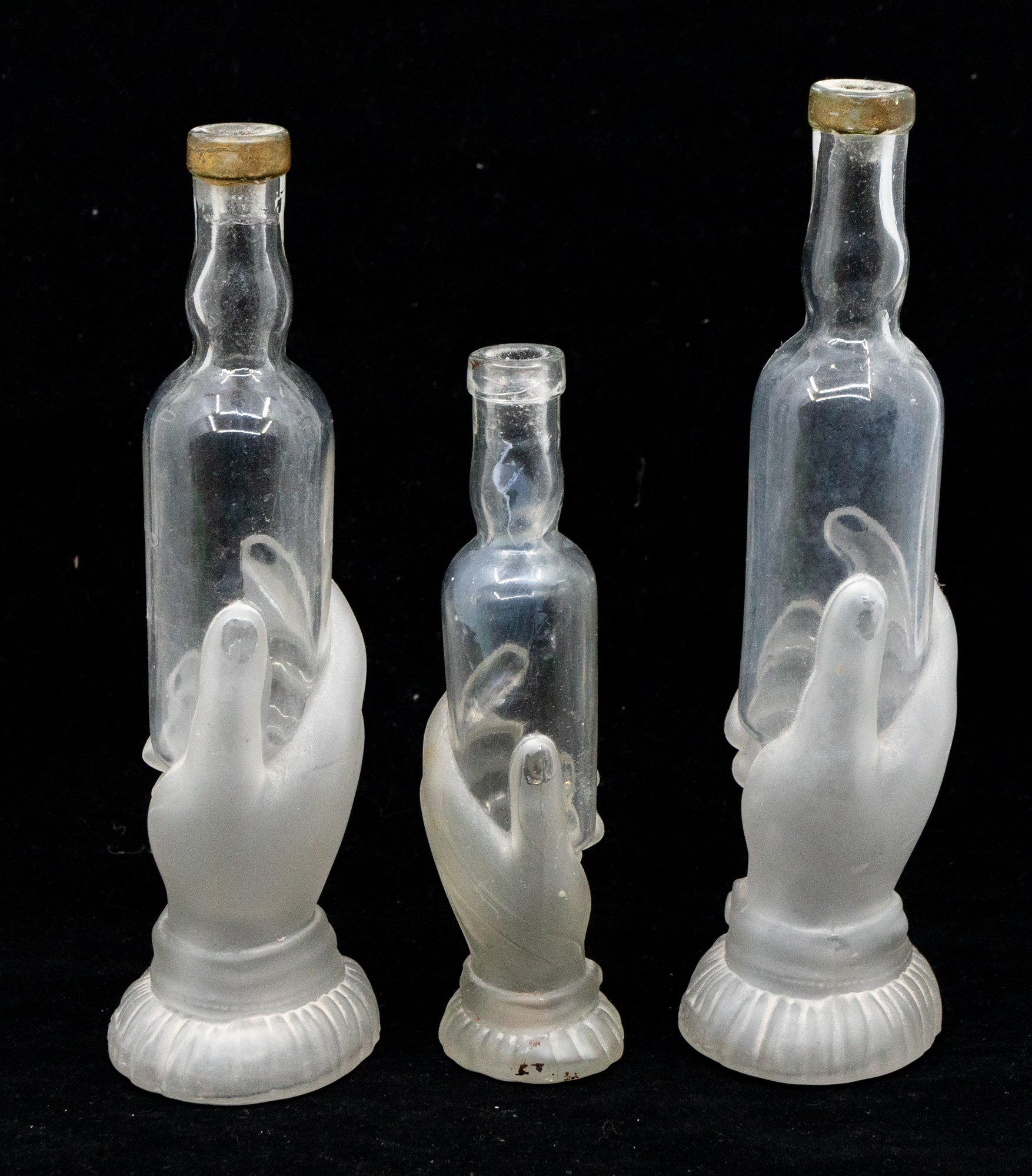 Three French 19th Century barber bottles, glass hand holding bottle, clear and frosted along with - Image 2 of 5