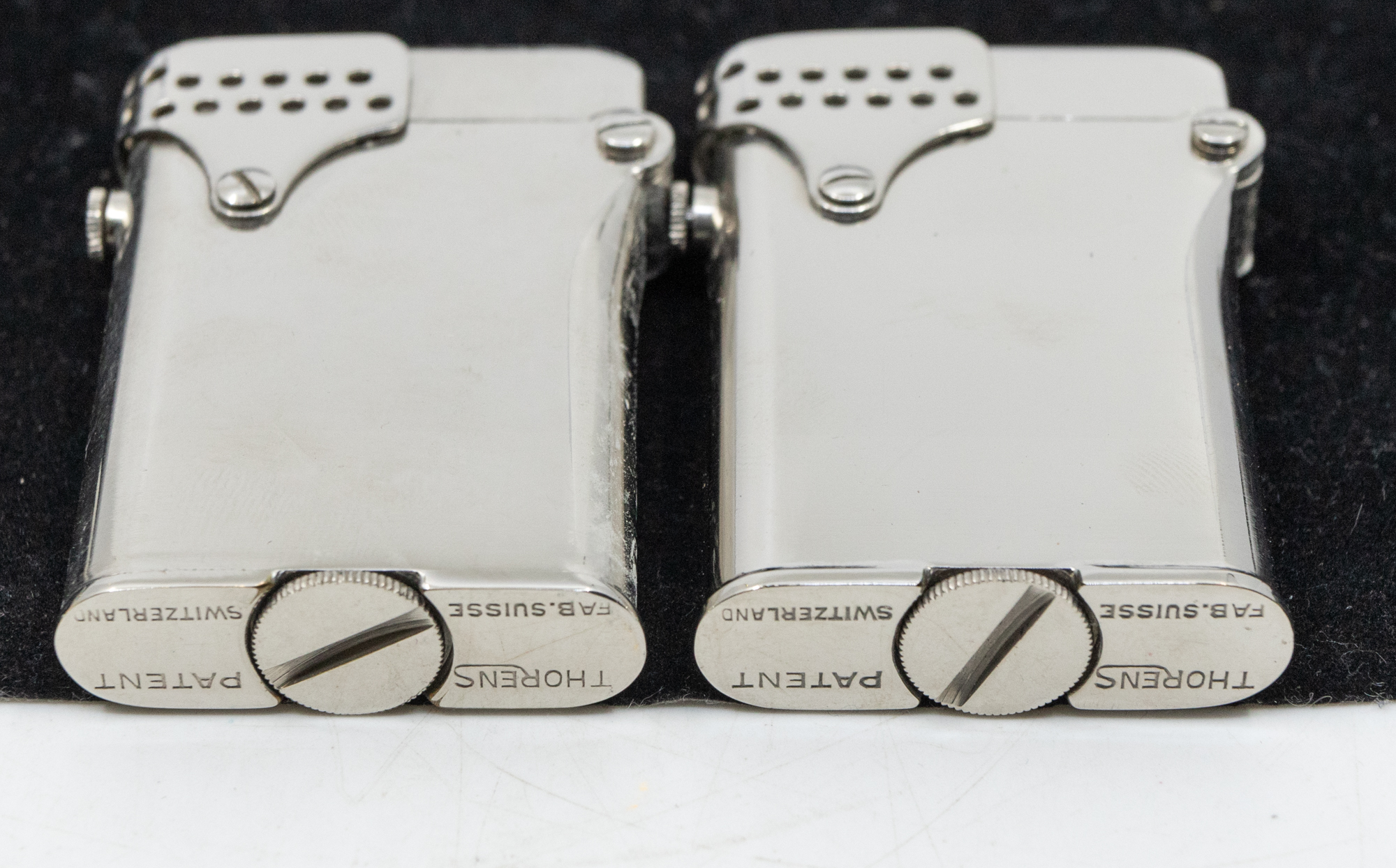 A collection of five Thorens plated or steel cased lighters, all of same rectangular shape with - Bild 4 aus 4