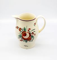 A Leeds creamware jug with a painted rose decoration and leaf sprays  Circa 1780-1800.  Size 18cm