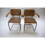 A pair of Marcel Breuer cantilever chairs in chrome and rattan, marked 'Made in Italy'