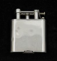 A George V silver lighter, of oval shape with plain design, hallmarked by  Wagner & Gerstley Ltd,