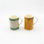 A creamware mug with two green and four black bands with black swags to the centre, along with a