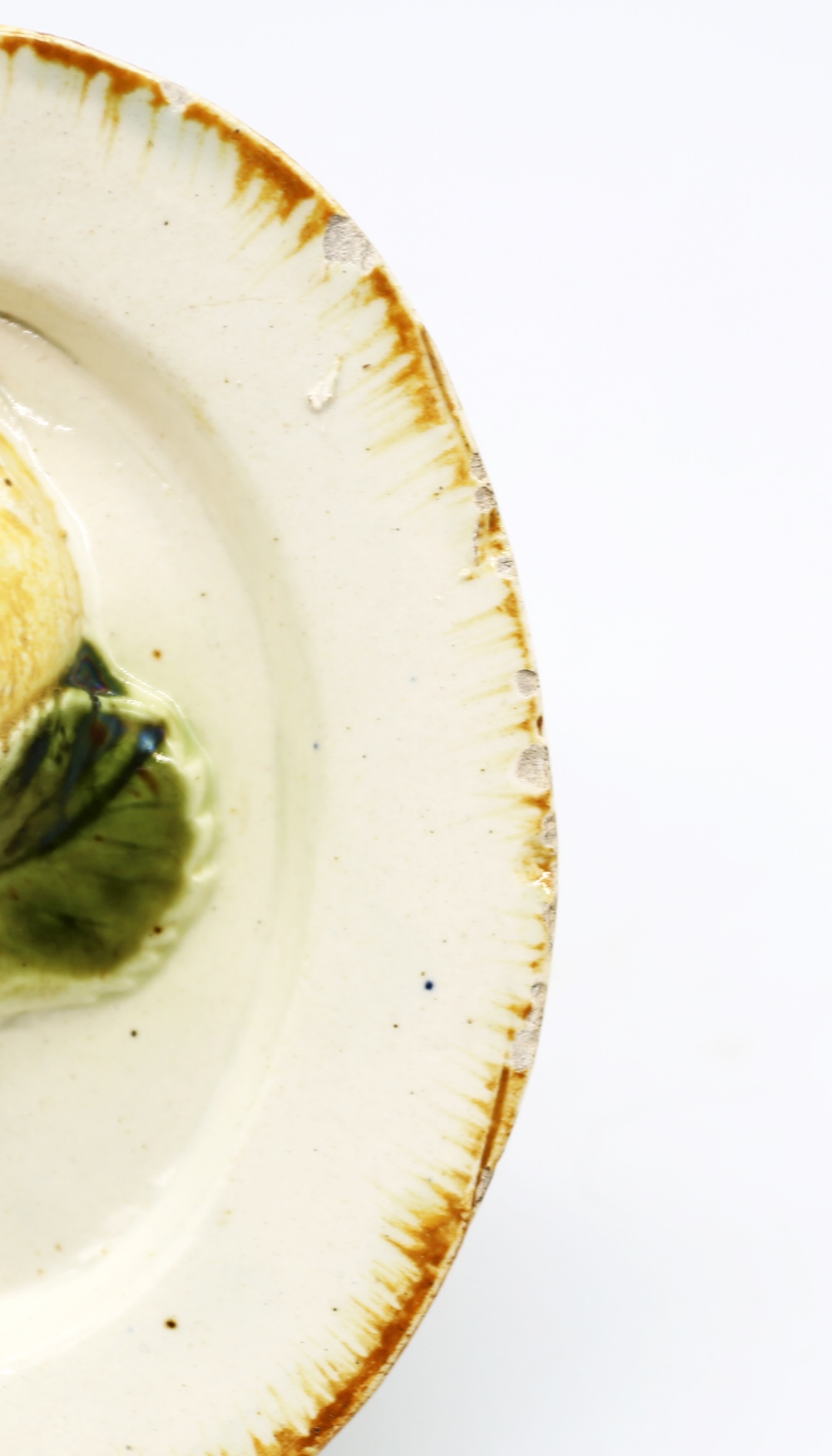 A creamware ‘Toy’ oval platter with an apple and foliage moulded in the centre, with an ochre - Image 4 of 8