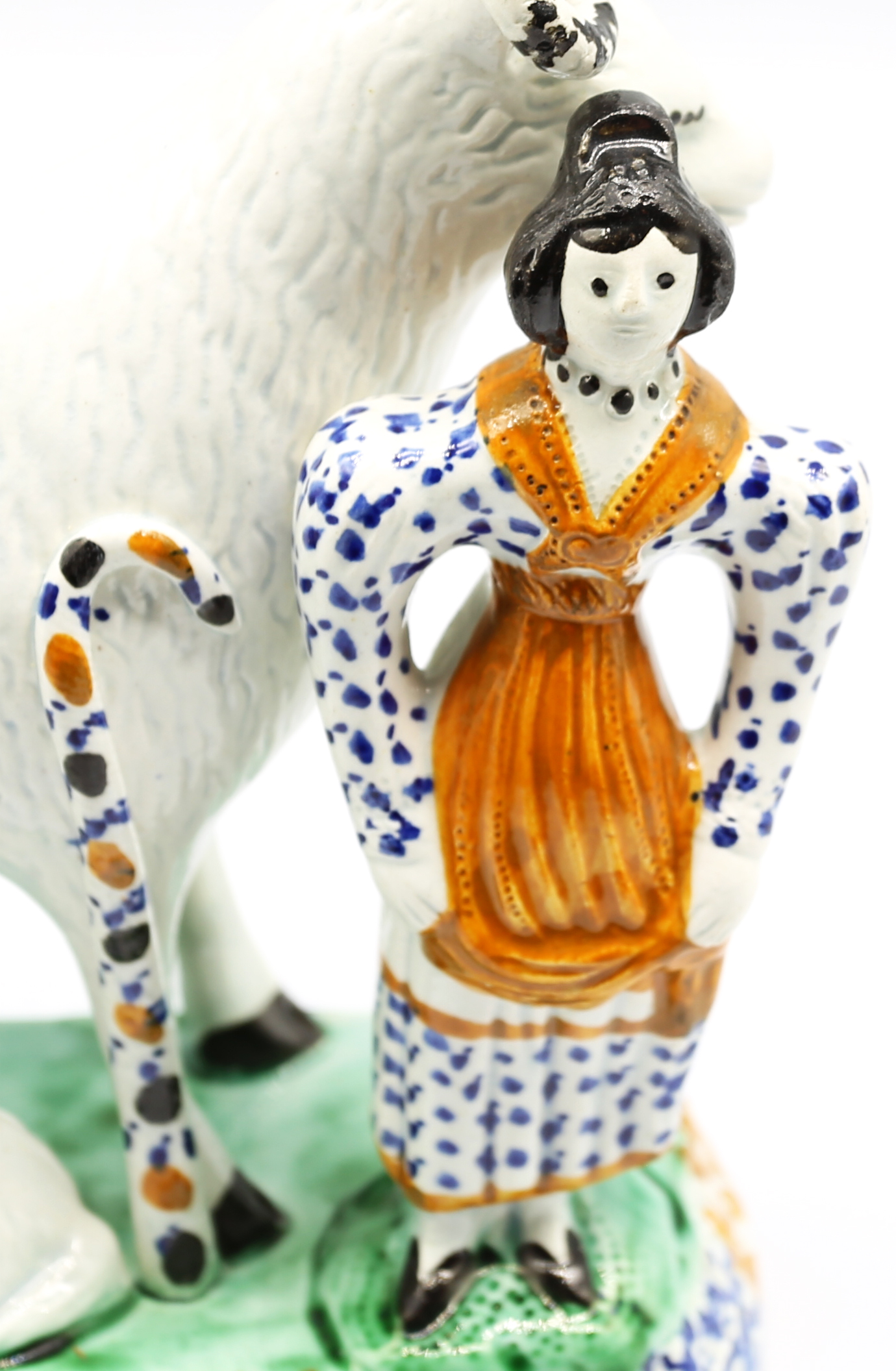 A Prattware model of a sheep and her lambs laying beneath her, with a shepherdess standing to the - Image 6 of 15