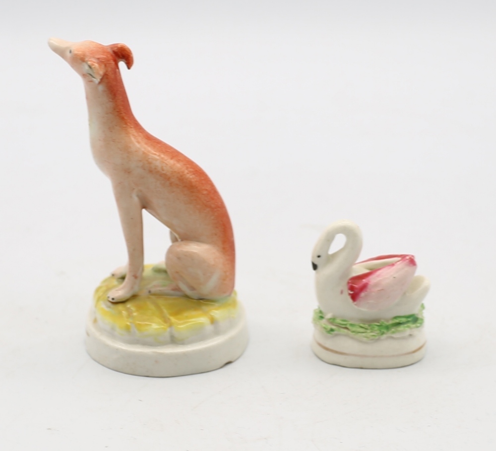 A Small Staffordshire pottery Whippet sitting a a round green base with a gilt band, along with a - Image 3 of 5
