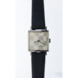 Girard- Perregaux - a ladies steel cased wristwatch, comprising a signed square silvered