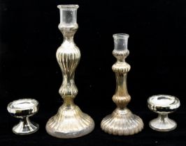 Two mid 19th Century glass candle sticks with silvered interiors, hand blown along with two later