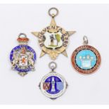 A collection of fob medals to include: a Victorian silver gilt star shaped fob medal, central shield