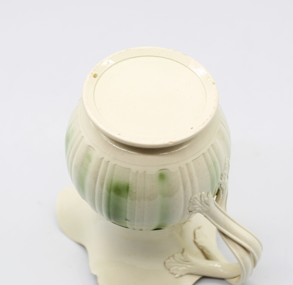A Leeds creamware jug, with a flared scalloped rim and spout with a crossed strap handle, - Image 9 of 9