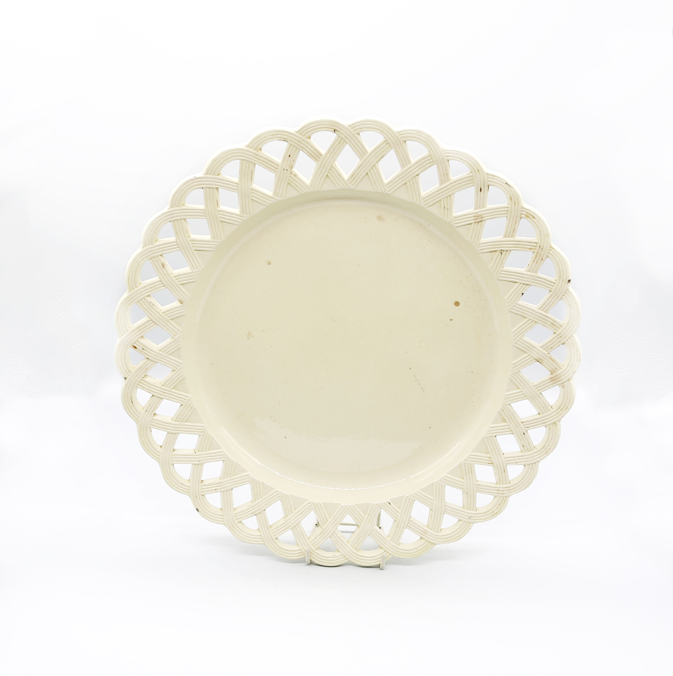 A large round creamware  platter with a basket weave rim  Circa 1780. Size. 35cm diameter.