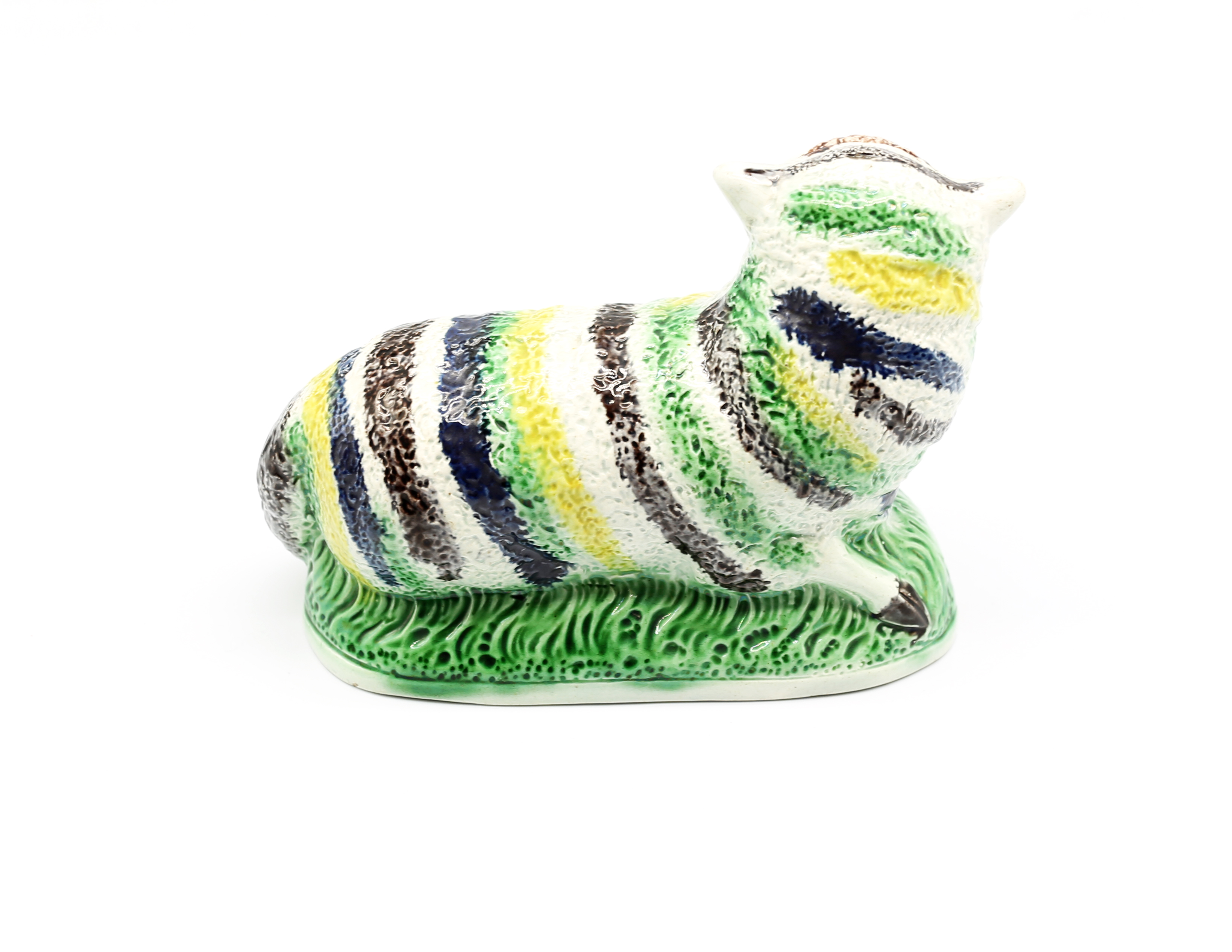 A pottery model of a recumbent Ewe, decorated with green, yellow and black stripes.  Circa 1800- - Image 3 of 7