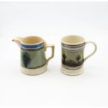 A pint sized Mocha ware mug, green ground with black feathered trees and pale blue and black