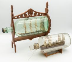 Two 19th century wooden models of Ship's in glass bottles; one encased in a light wooden frame of