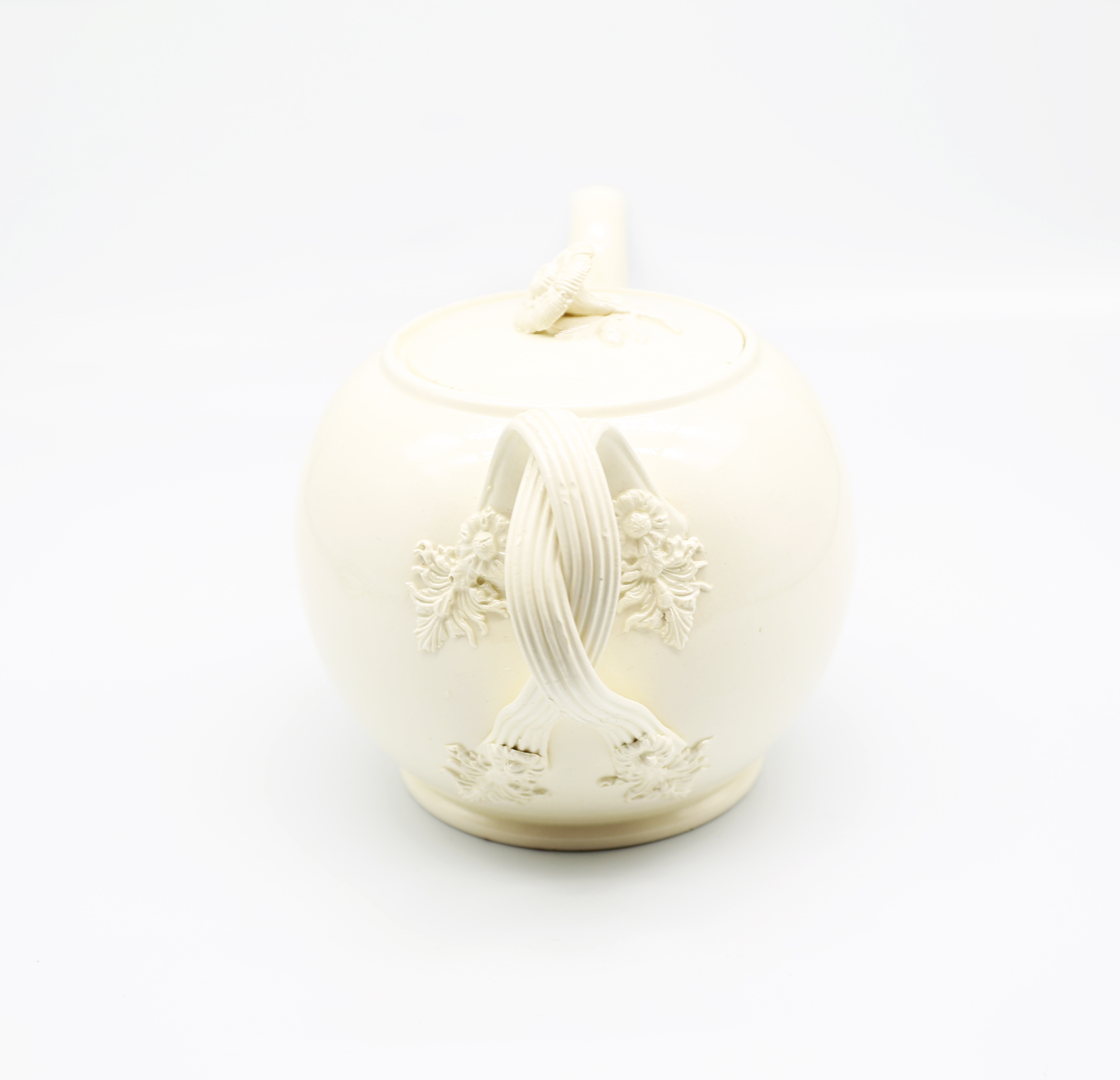 A Leeds creamware globular teapot and cover, with a twisted strap handle and floret terminals, the - Image 2 of 17