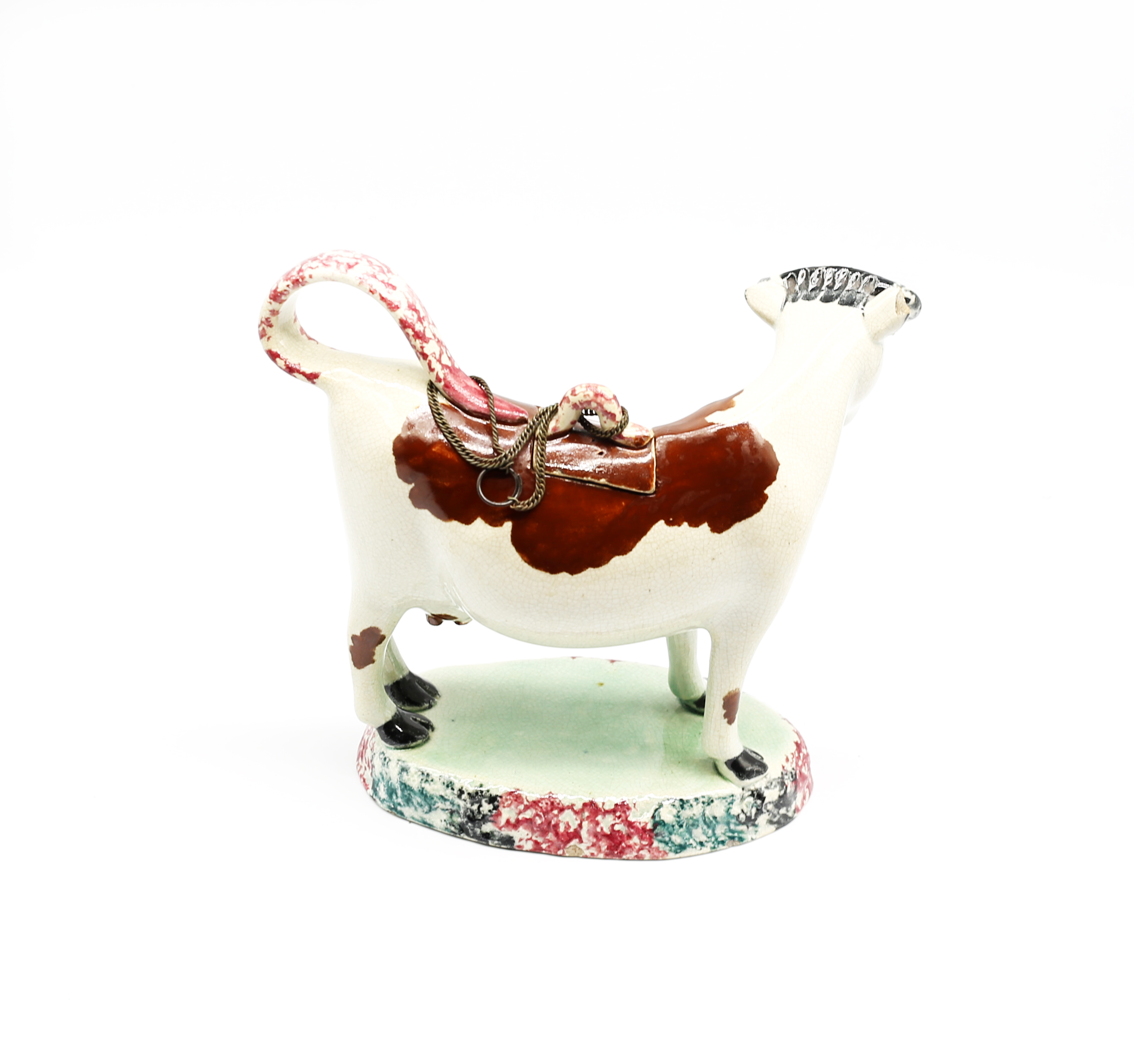 A North country pottery cow creamer and cover, standing on a green base with a mottled coloured base - Image 3 of 13