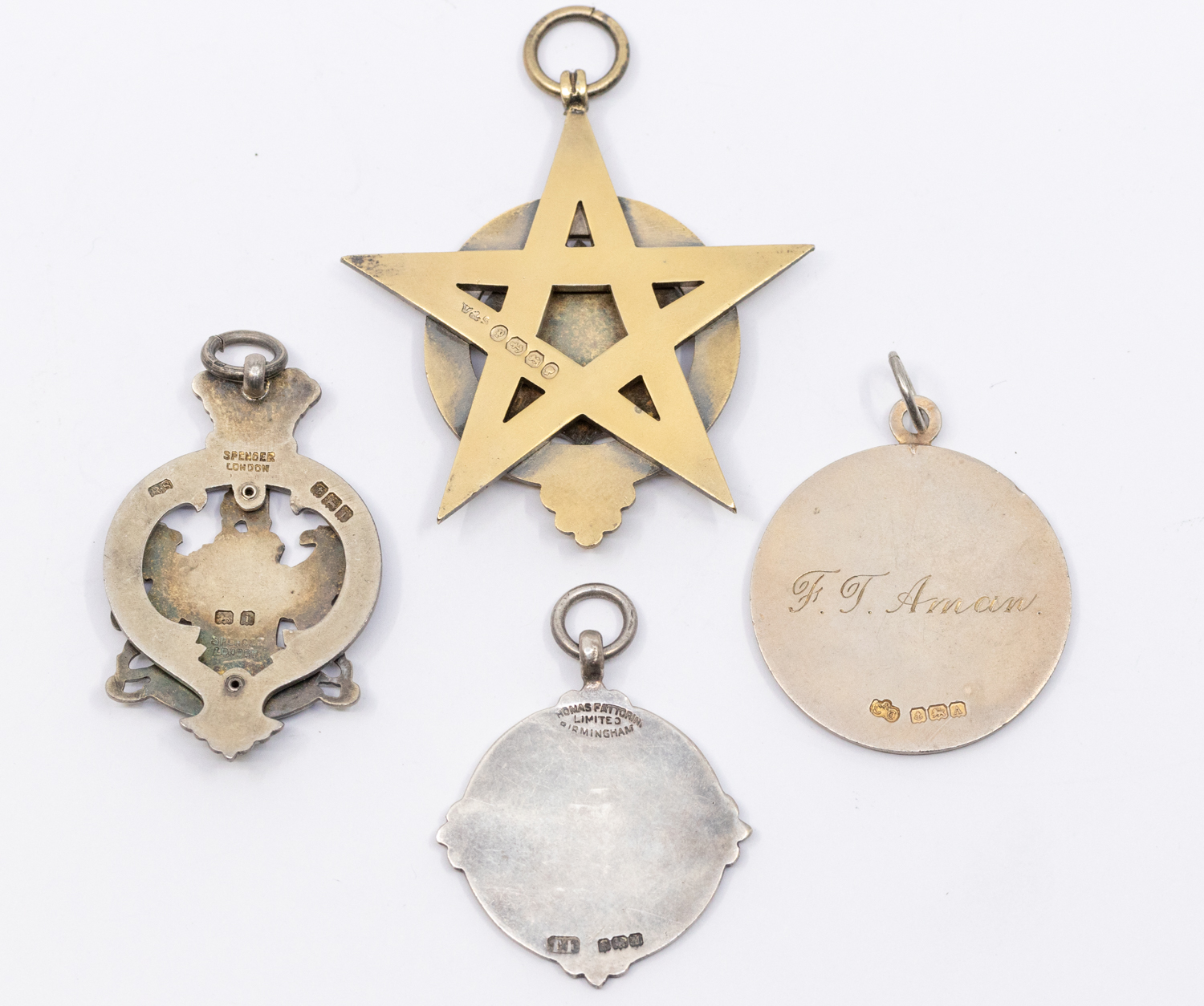 A collection of fob medals to include: a Victorian silver gilt star shaped fob medal, central shield - Image 2 of 2