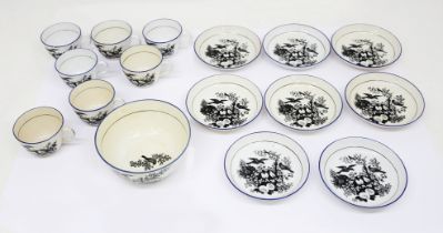 A collection of 19th century pearlware cups and saucers and a slop bowl, black printed with birds in