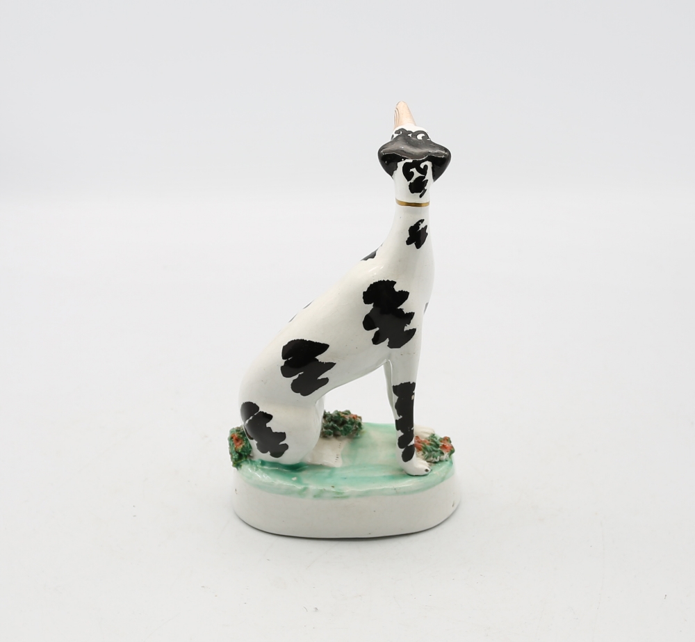 A Staffordshire potter model of a seated black and white Dalmatian on a green oval base.  Circa - Image 3 of 5