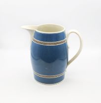 A large pearlware pitcher, blue ground with black and white checkered bands.  Benton collection