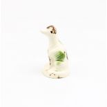 A Staffordshire creamware Whieldon style  model of a seated dog, sponge decorated in shades of green
