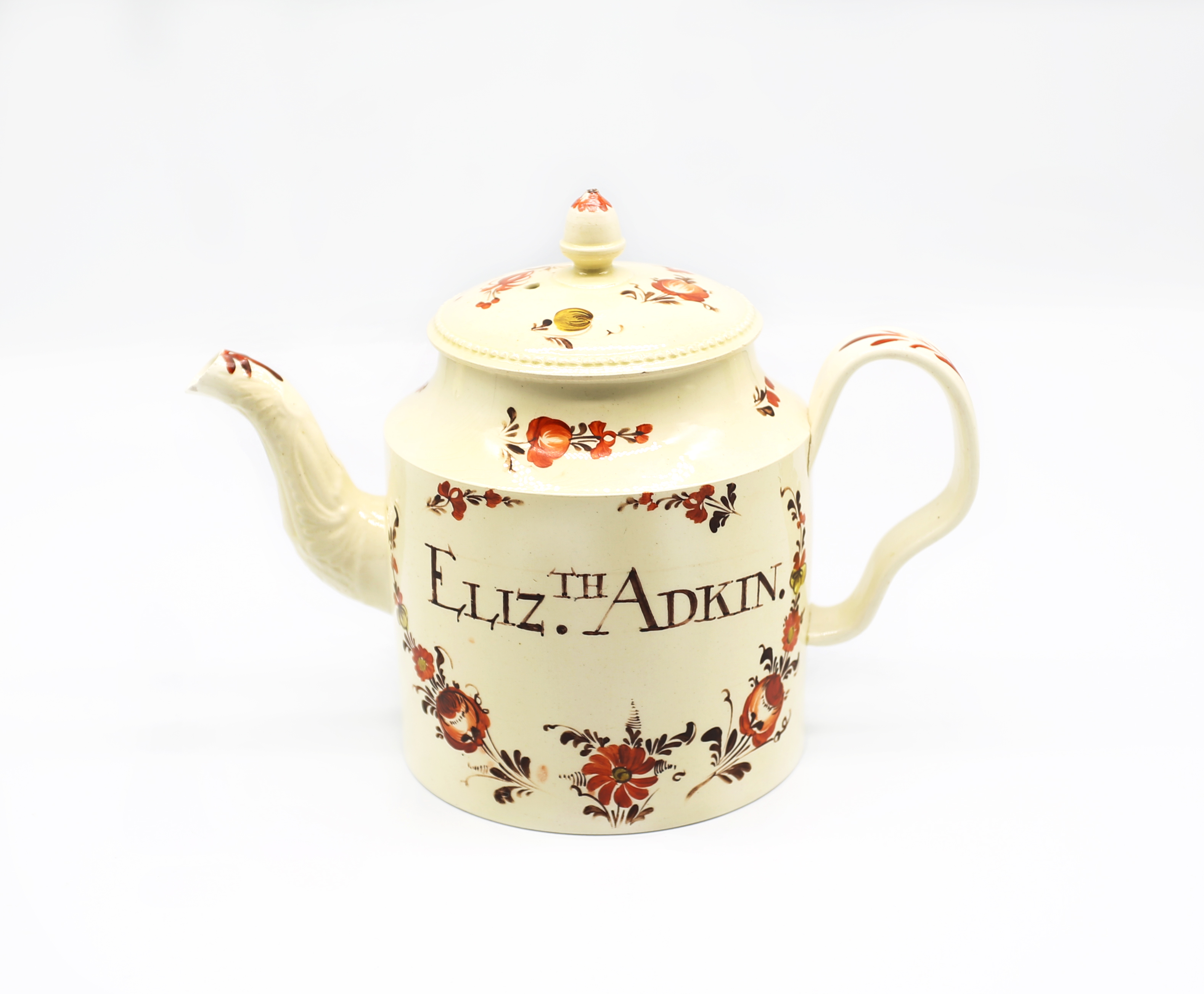 A Staffordshire Creamware William Greatbatch cylindrical teapot and cover, with an ear shaped handle