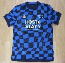 Derby County: A signed Derby County 2023-24 away shirt, signed by twenty-eight members of the
