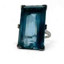 An estimated 13.49 carat Art Deco style aquamarine cocktail ring. Set with a rectangular step cut