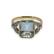 An early 20th century aquamarine and diamond ring. Featuring a central emerald cut aquamarine,