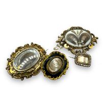 A collection of three 19th century fine hairwork mourning brooches. Featuring a double sided