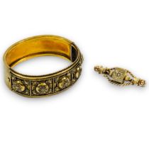 A Victorian Etruscan revival bangle in yellow metal, testing as 15ct gold, gross weight