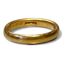 A 22ct gold band ring. SIze O. Approximate weight 6.08 grams.
