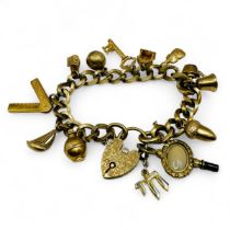 A 9ct gold charm bracelet, with 11 9ct gold charms, a chalcedony set rolled gold watch key and a