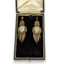 A pair of Victorian archaeological revival style cameo set fringed earrings. Featuring sardonyx