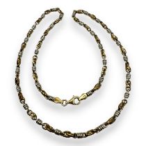 A 9ct bi-colour gold fancy link necklace. Featuring alternating white and yellow gold, to a