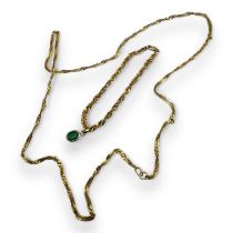 An emerald pendant, together with a 750 stamped precious yellow metal bracelet and a similar