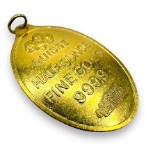 A pendant featuring a "Suisse half ounce fine gold 999.9" medallion. Testing accordingly. Gross