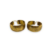 A pair of precious yellow metal hoop earrings, testing as 14ct gold. Approximate weight 4.55 grams.