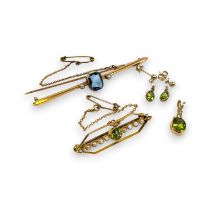 A collection of peridot set jewellery. Featuring a "15ct" stamped seed pearl and Peridot Edwardian