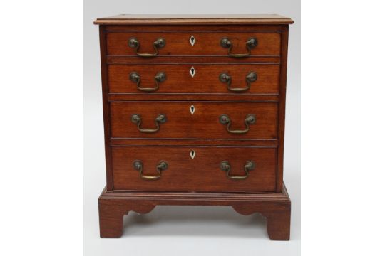 A Victorian mahogany apprentice piece chest, the rectangular top with moulded edge, over four - Image 1 of 3