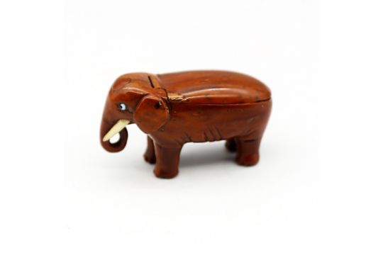A late 18th/early 19th century carved coquilla nut snuff box, carved as an elephant, small glass - Image 1 of 6