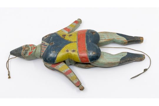 A 19th century Folk Art carved wood and painted Jumping Jack toy, decorated in the form of a - Image 1 of 2