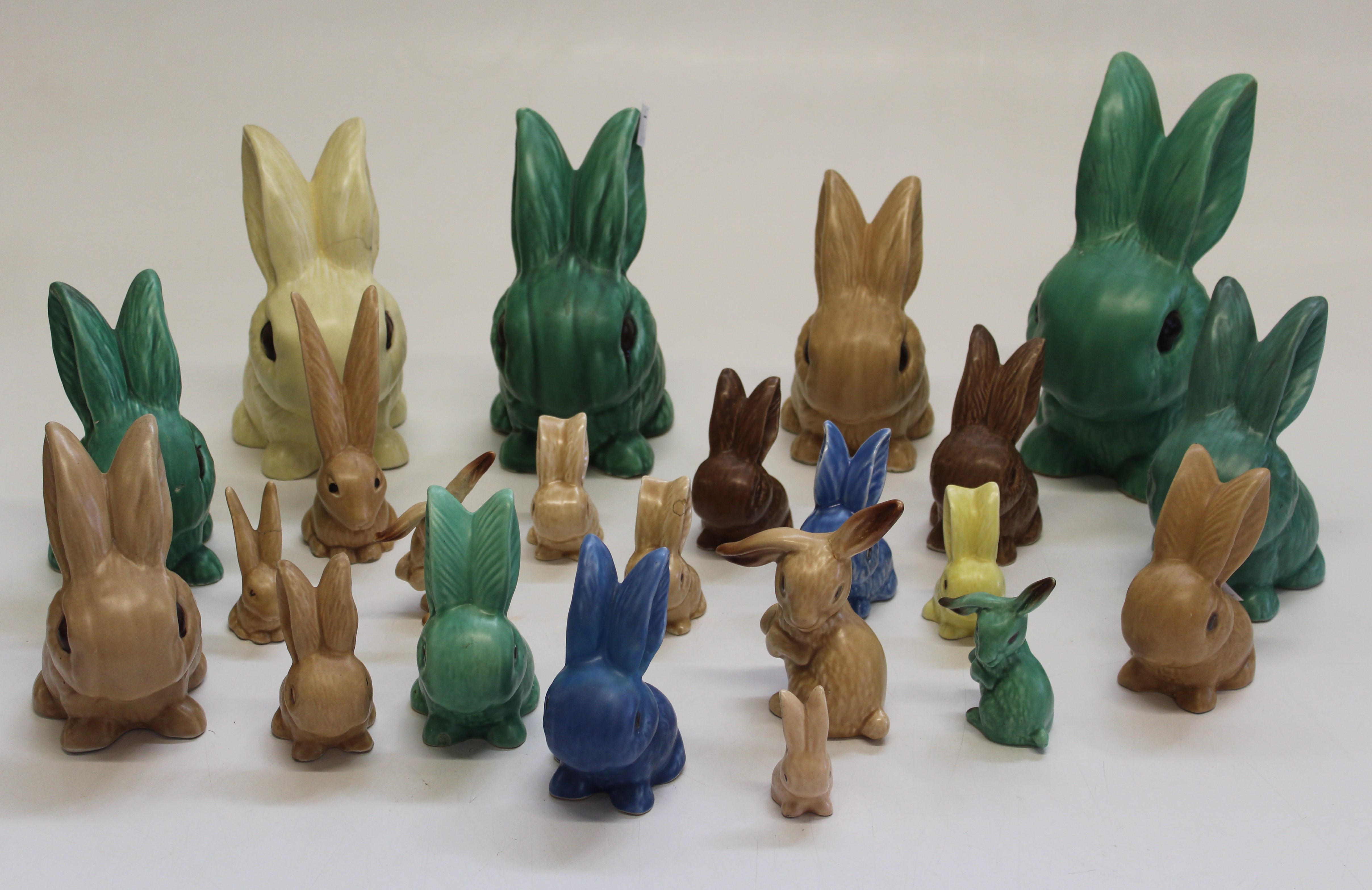 A collection of twenty three Sylvac rabbits. The smallest, caramel ...