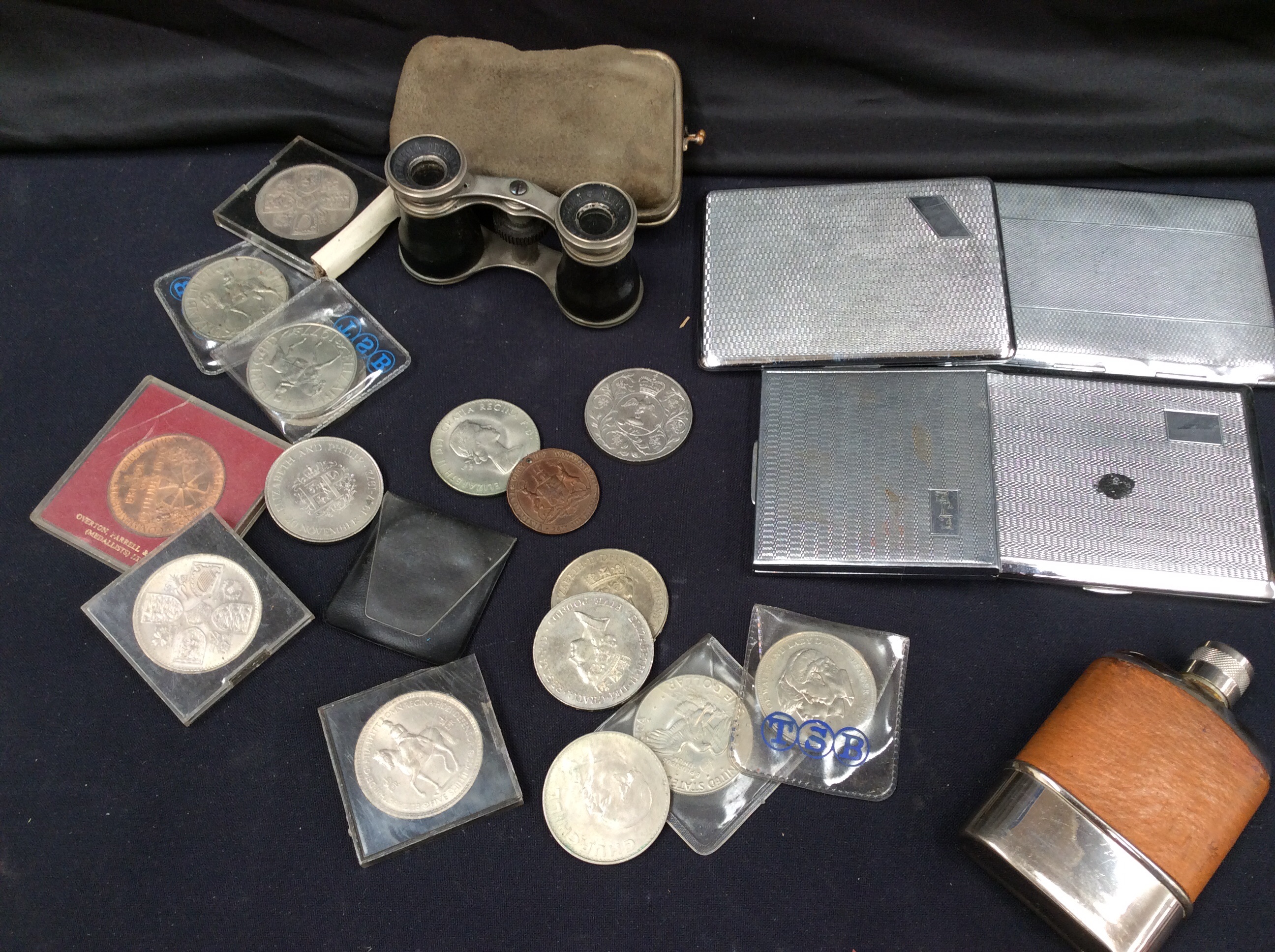 Commemorative coins, theatre glasses and vintage cigarette cases.