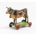 Meier: An early 20th century, lithographed tinplate penny toy standing cow. Made in Germany, by