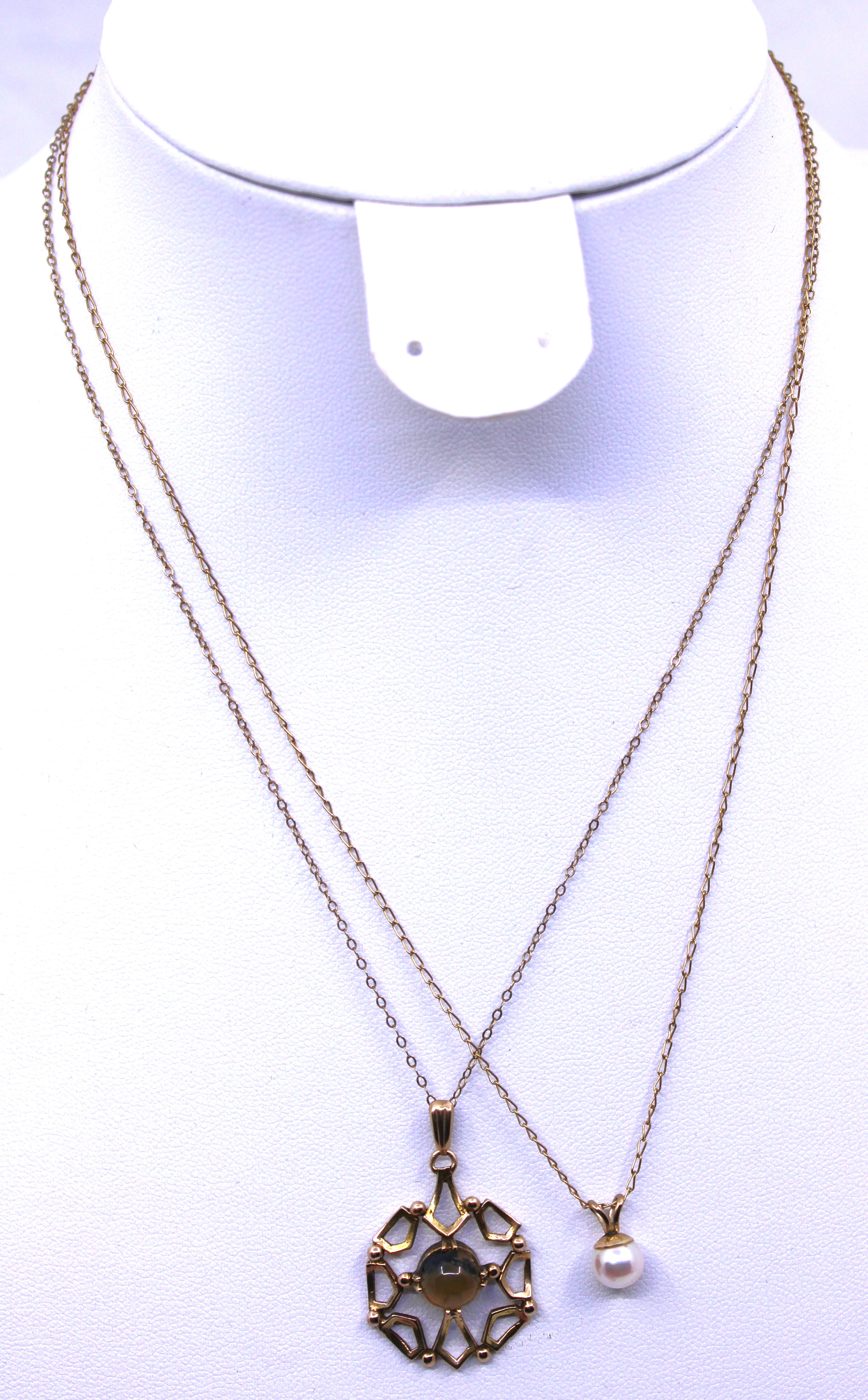 Two 9ct Gold Pendant and Chains.  To include a 9ct Gold Round Cabochon Dendritic Agate Pendant and