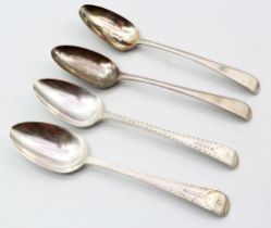 A pair of George III Old English patterned silver table spoons, engraved edging and with rampant